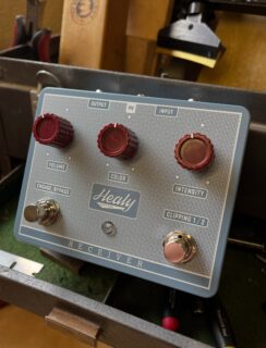 This Saturday! Stompbox Sonic is happening in Sommerville, MA at Arts in The Armory. @stompboxsonic 

We debuted our new drive pedal, called the RECEIVER, which we developed with our good friend Ryan @argonaut_guitar_components in late 2025. We sold some to local clients and everyone has responded with great endorsements! 

The pedal is based on classic 70’s single transistor overdrives, with 2 different clipping options accessed directly on the Right footswitch. When the Red LED is on, it’s LED clipping. When the Blue LED is on, it’s Diode clipping. 

VOLUME = Volume...COLOR = Tone…INTENSITY = Gain
ENGAGE/BYPASS = On/Off… CLIPPING 1/2 = Diode or LED 
 Each channel also runs through a boost circuit so that the levels of each style can be dialed in. We do this adjustment in house to our liking. The LED side inherently has a slight bump in volume and body that allows you to switch to that side for a solo or just a change in character. I’ve been changing channels when I switch guitars during our set to balance the output. Thanks a million to Ryan for the collaboration journey and @obscuramfg for the awesome work on the enclosures.

We will have 6 of them available at the show on Saturday. After that we will be working on dialing in the packaging, instructions, and demos, and then we’ll open up for orders. Hope to see you in Boston!

#stompboxsonic #healyguitars #healyreceiver #madeinMassachusetts